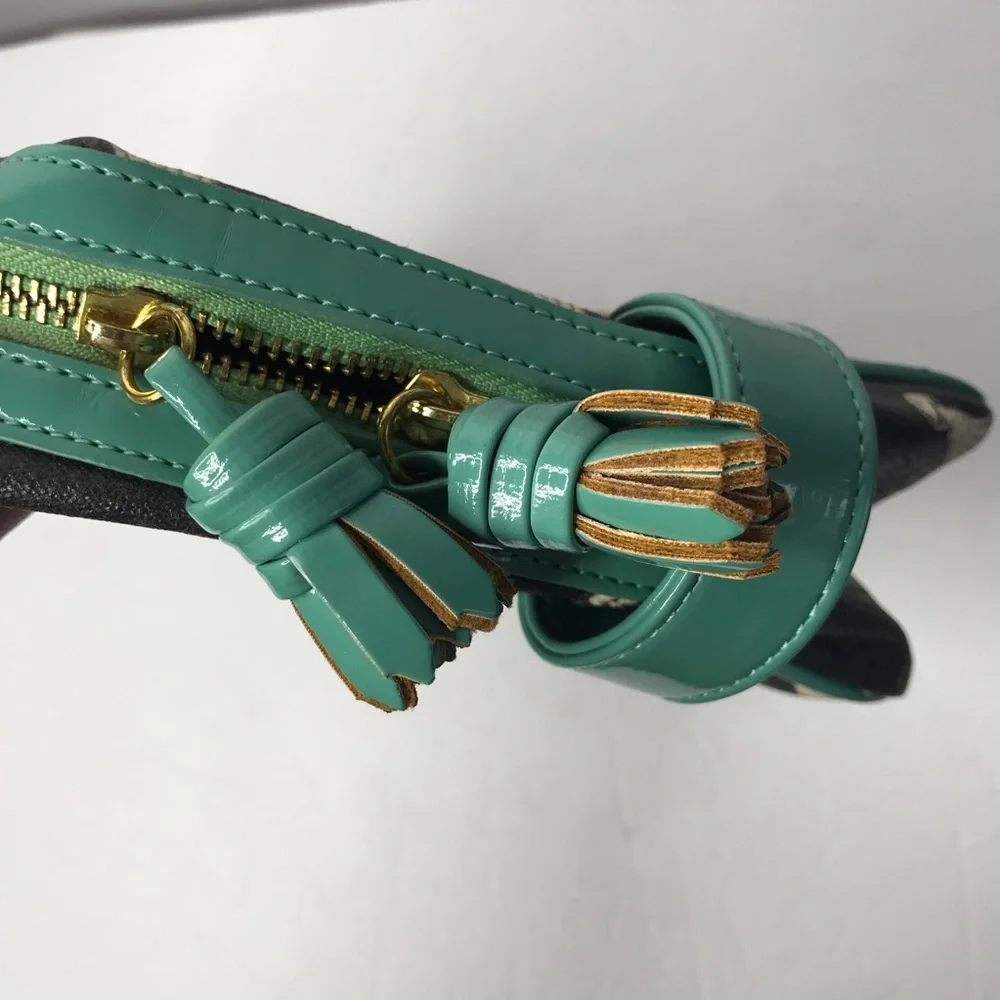 Isabella Fiore black and teal tassels make up bag